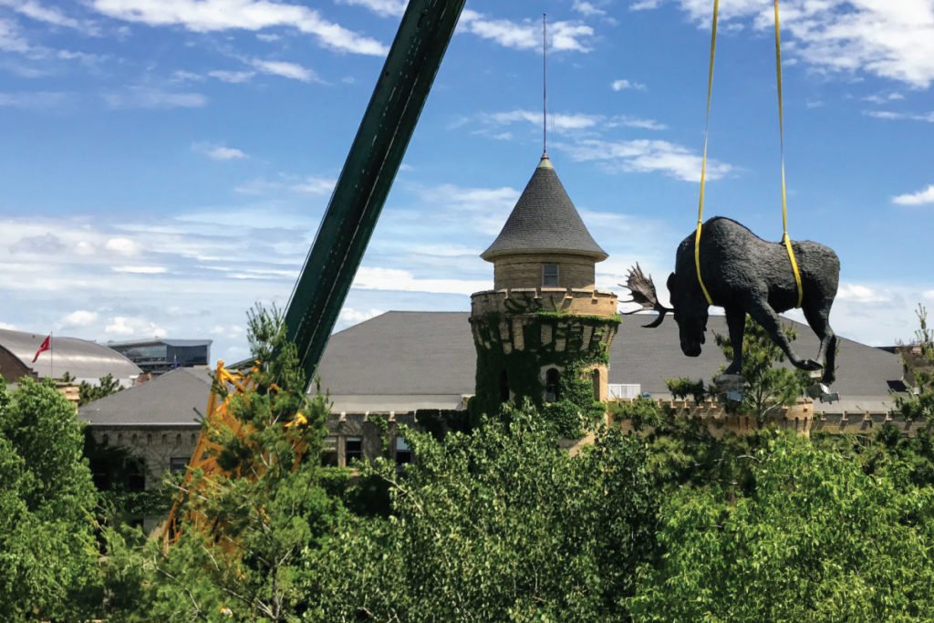 Moose sculpture craned above the treeline in front of the Bell's previous location