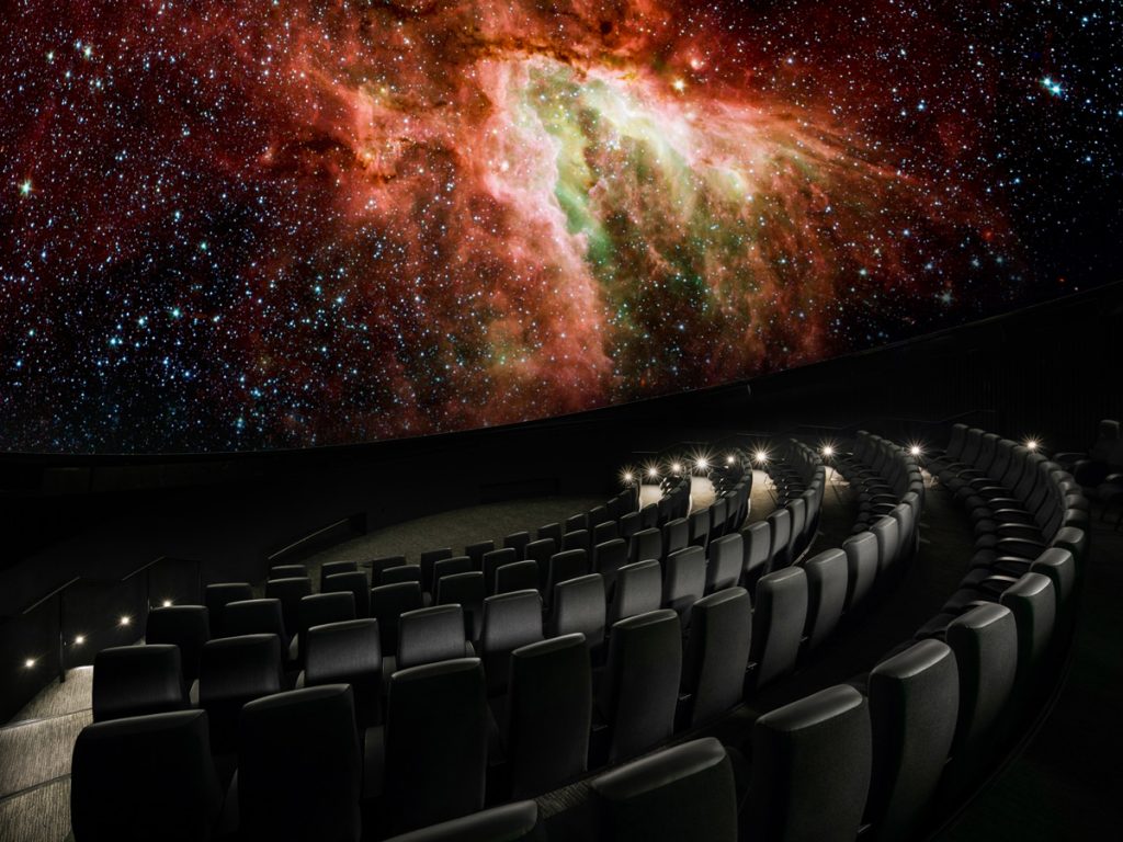 Empty theater in Bell planetarium, nebula projected on screen
