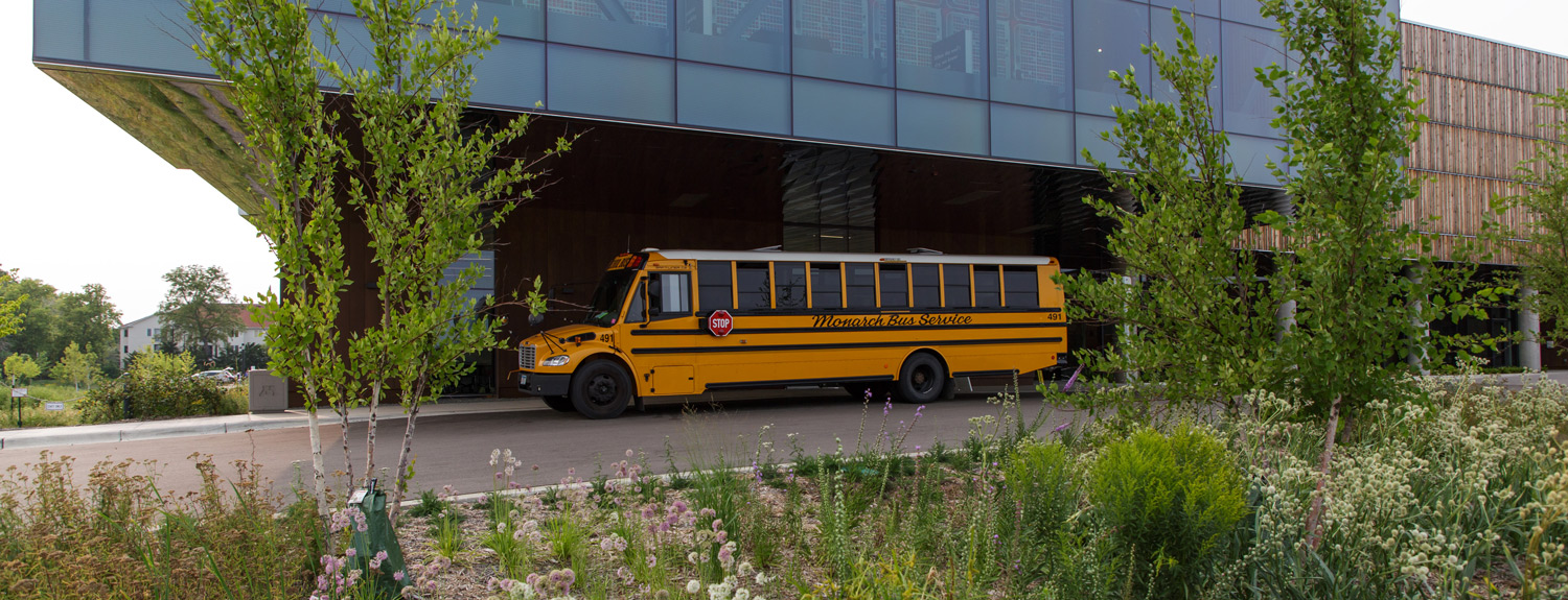 A school bus at the Bell's education entrance