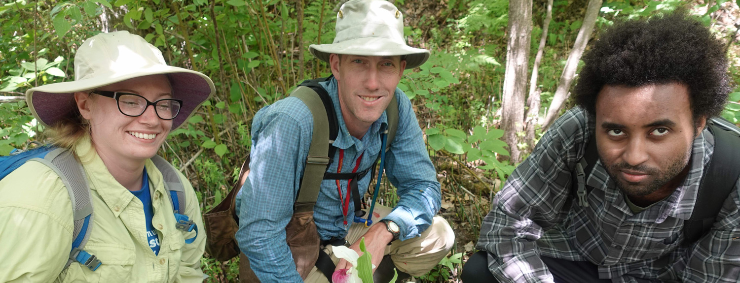 Tim Whitfield (center) on a collecting trip at the Mississippi headwaters with students Alexandra Crum (left) and Zacky Ezedin (right)