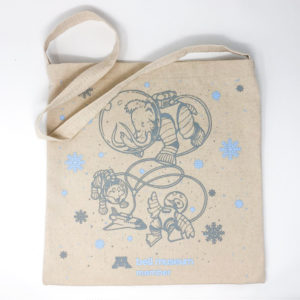 The member tote with illustrations of a mammoth, wolf, and loon in space