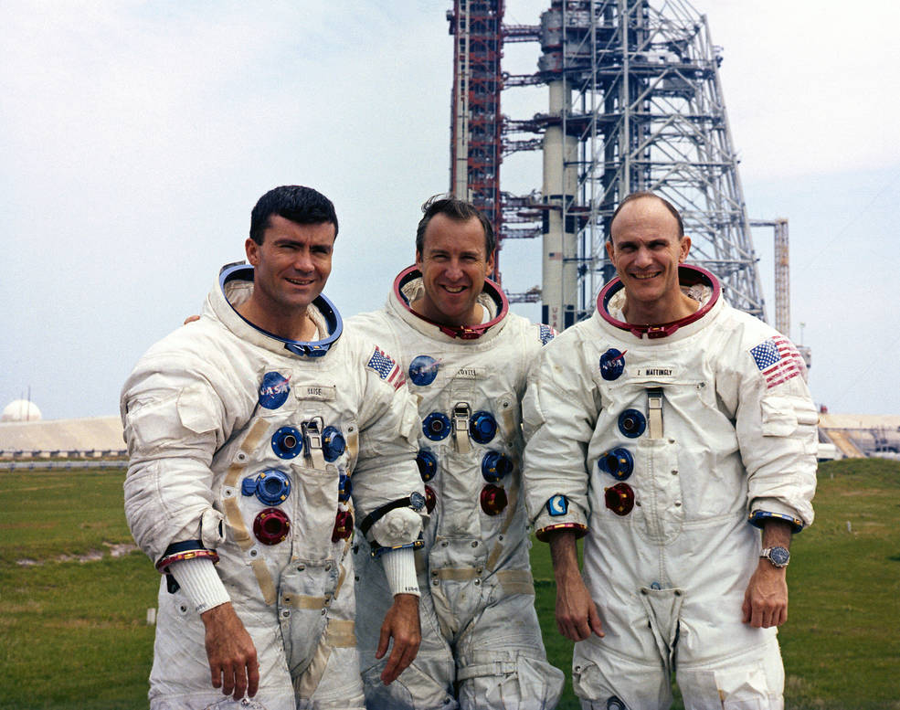 3 astronauts suited up at the launch pad