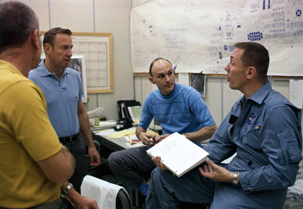 4 mission members chatting science