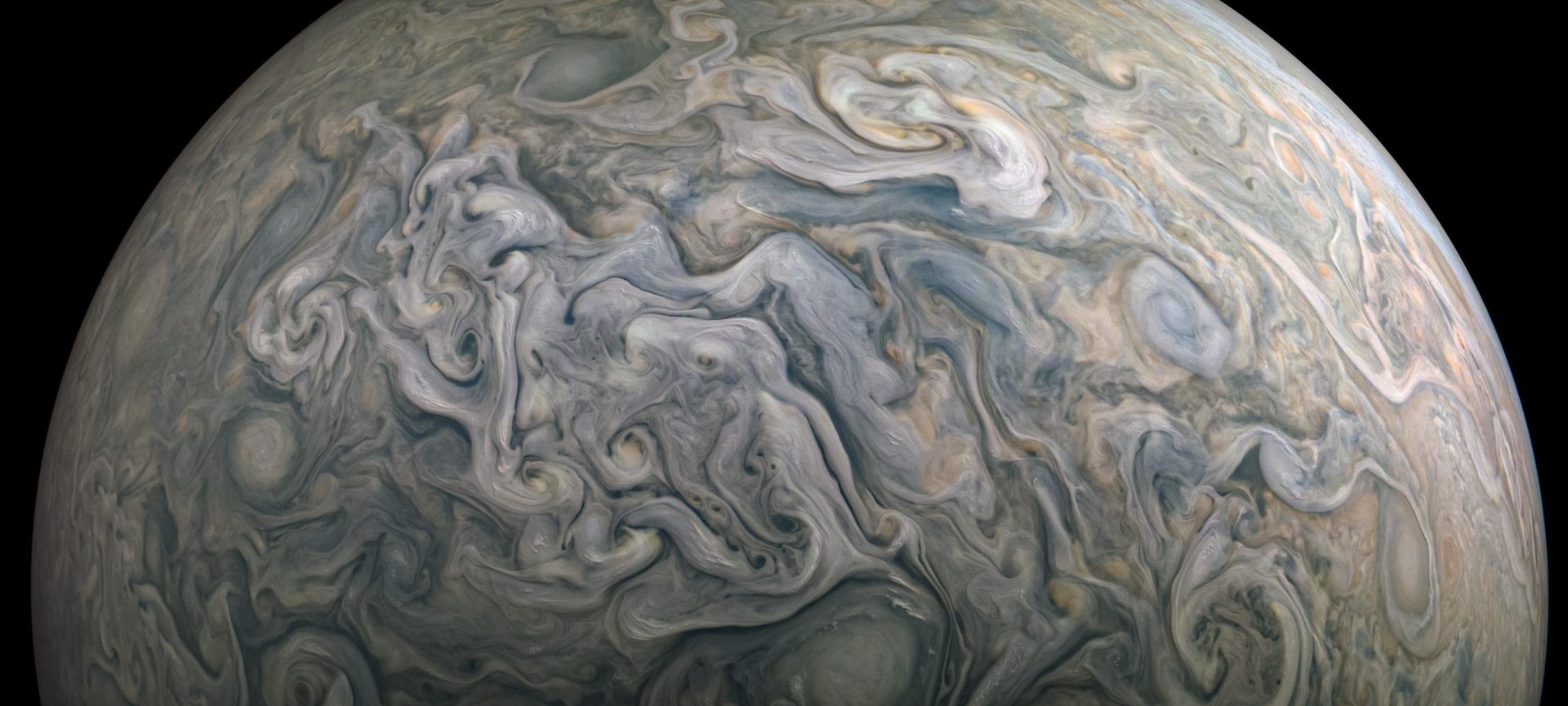 marbled blue-brown image of Jupiter's atmosphere