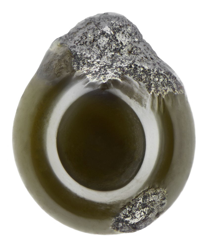 micrometeorite with white and silver ring