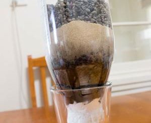 Water filtration experiment made from plastic soda bottle
