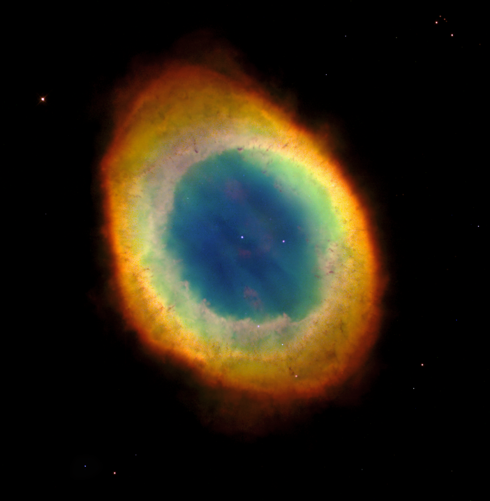 a beautiful circular nebula with a blue center and a red outer ring