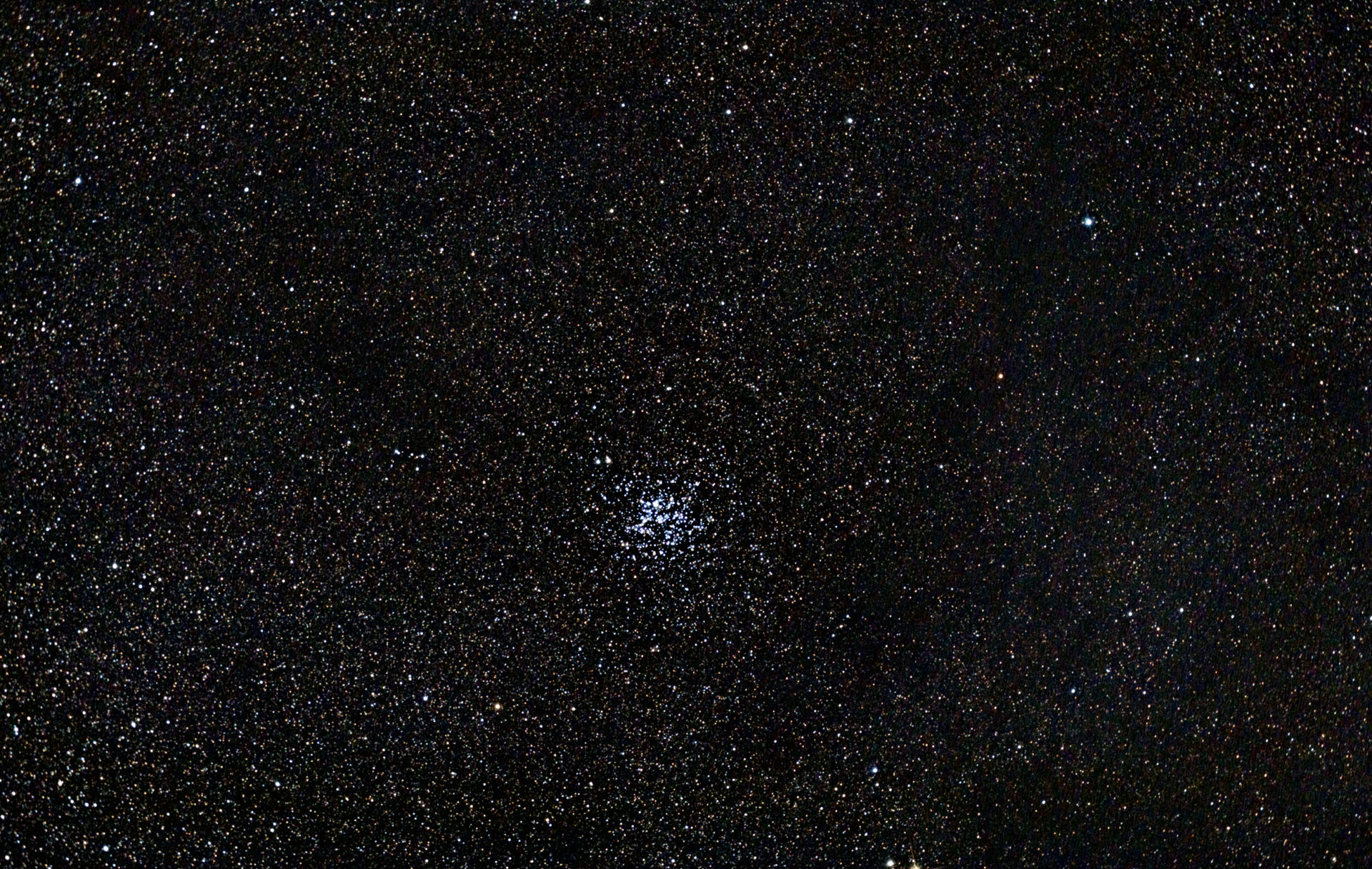 small central cluster of silver stars in space