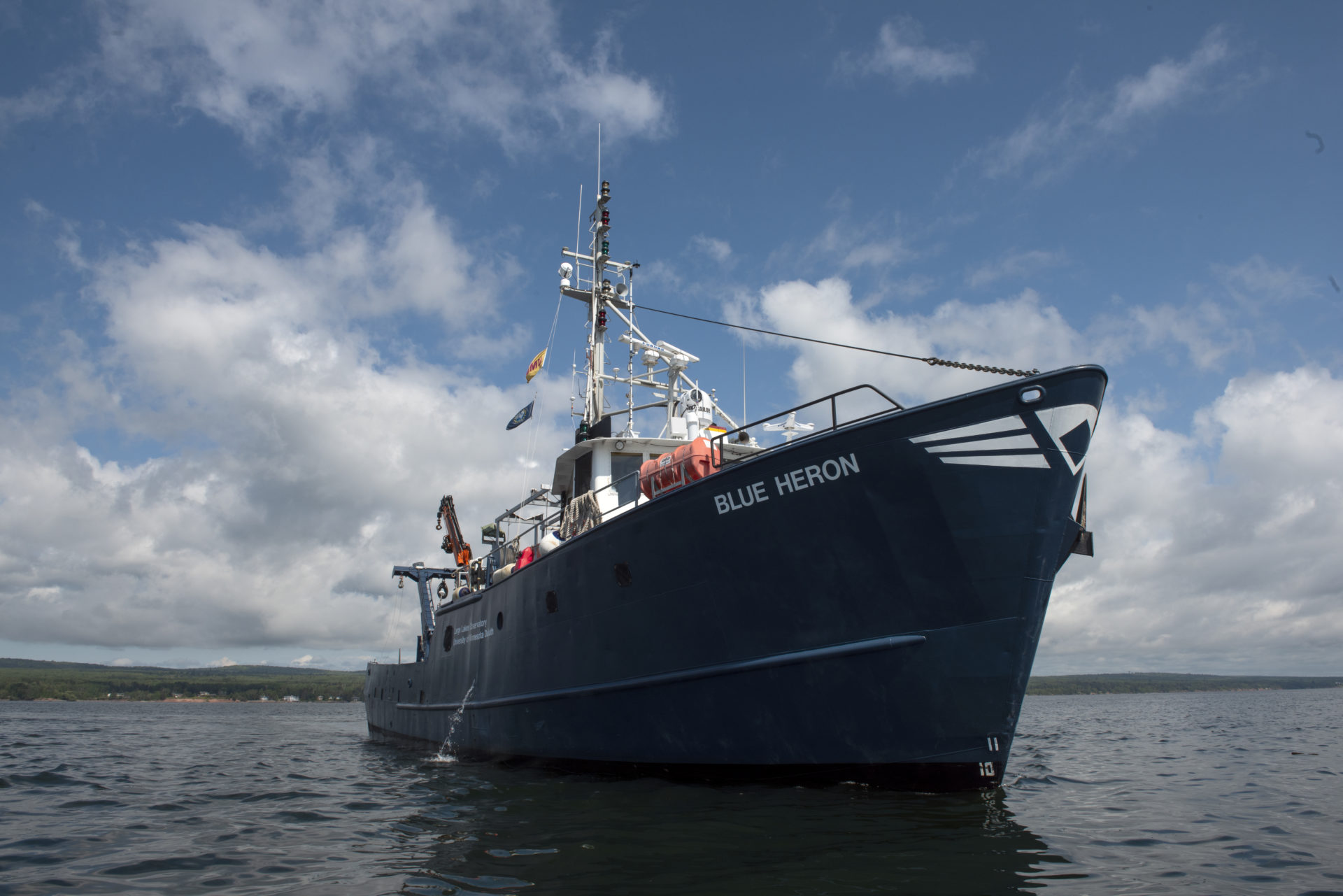 A large research vessel with the text, 