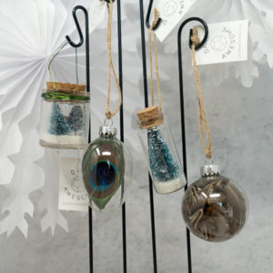 Glass ornaments hanging from a display