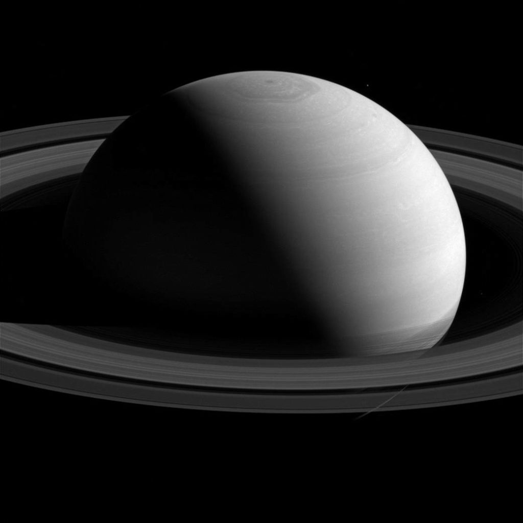A black and white image of Saturn and its rings
