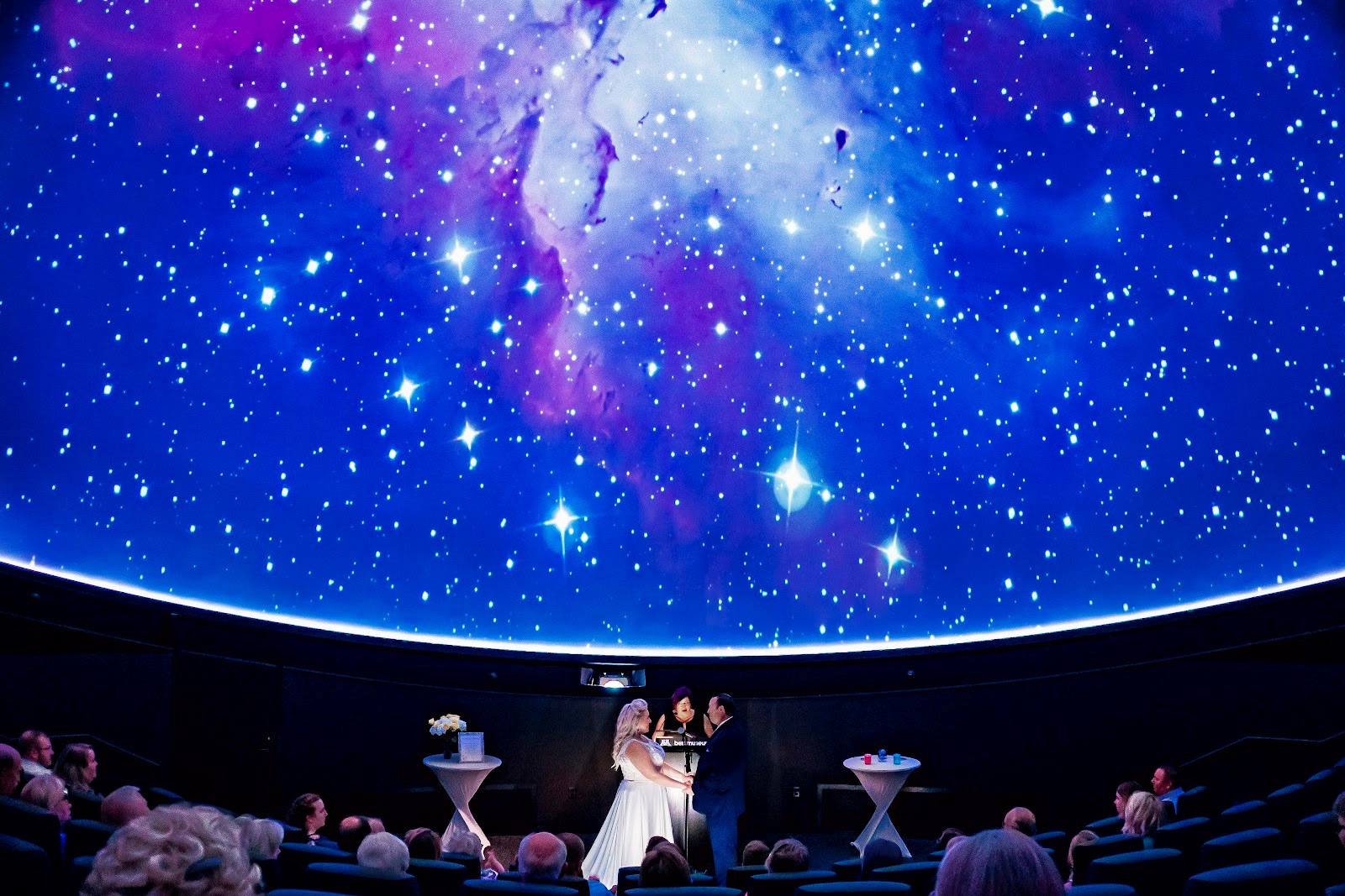 Newlyweds under the stars in the planetarium
