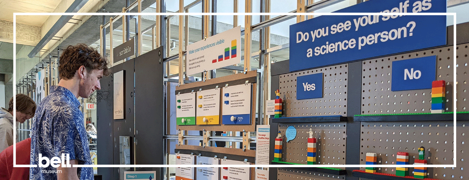 Visitor looking at display with Lego towers and text that reads: Do you see yourself as a science person?